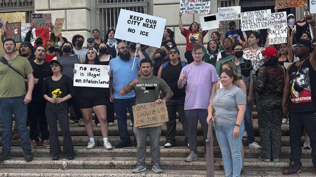 Marine veteran disrupts immigration protests with comedy sign, sparks liberal fury