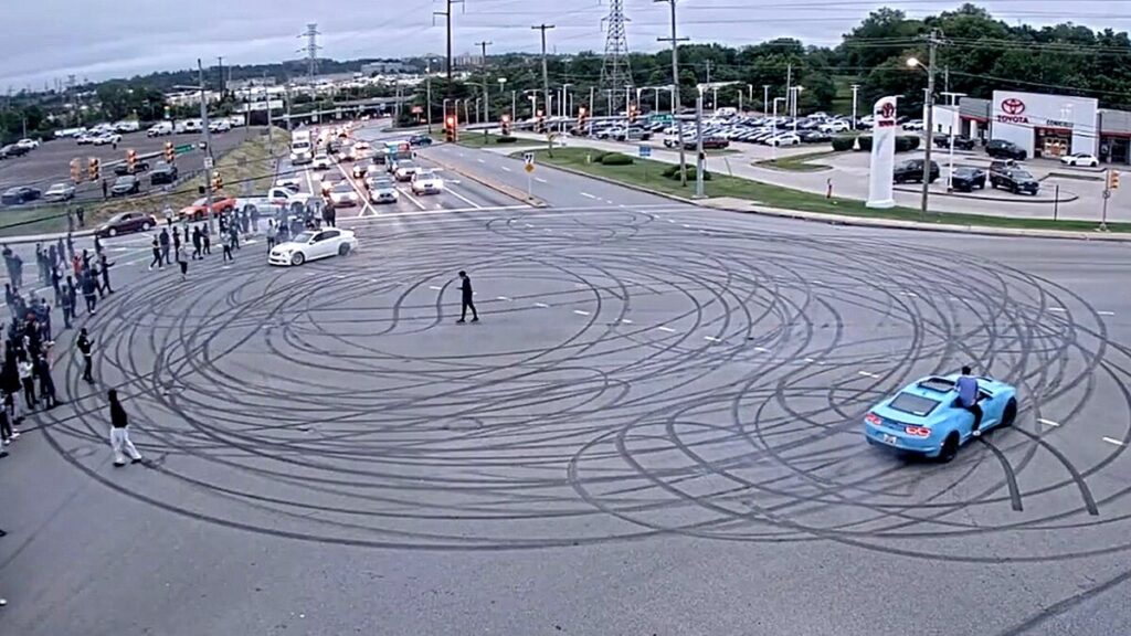 Illegal street takeover shuts down busy intersection with dangerous stunts, fireworks: police
