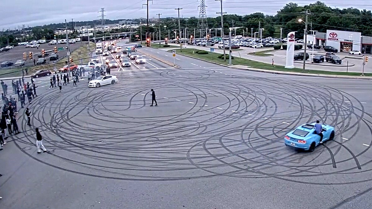 Illegal street takeover shuts down busy intersection with dangerous stunts, fireworks: police  at george magazine