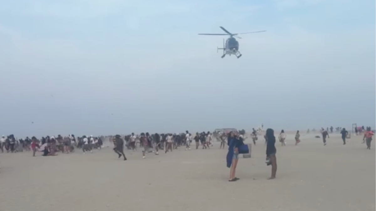 Hundreds of teenagers transform peaceful beach into chaos as police forced to break up fights  at george magazine