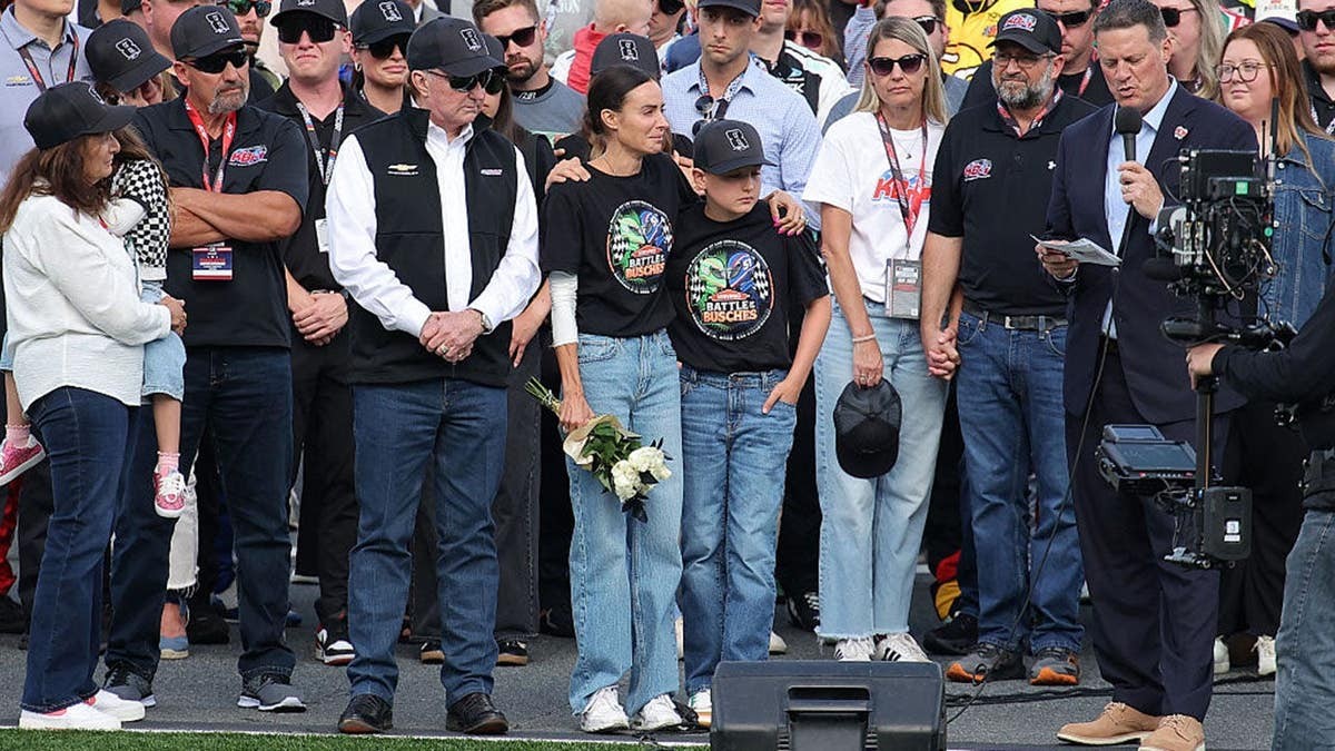 Kyle Busch's family surrounded by drivers and team owners during heartfelt Coca-Cola 600 ceremony at george magazine