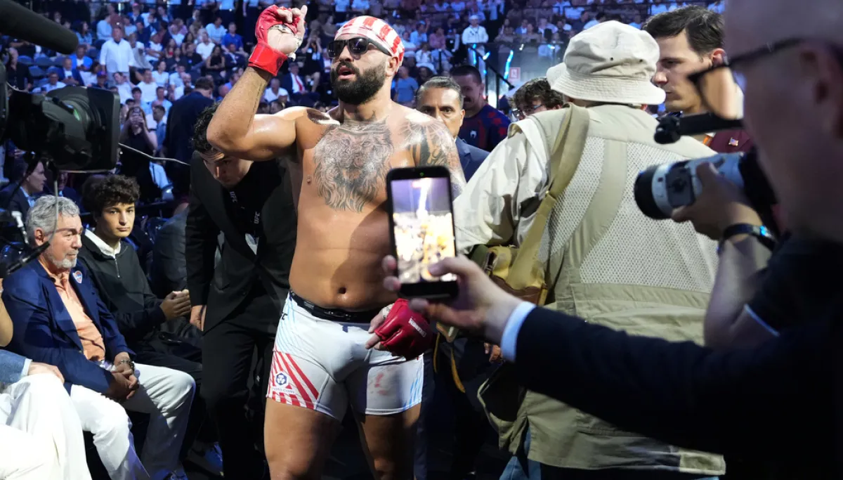 UFC fighter Josh Hokit mocks Michelle Obama in victory speech at george magazine