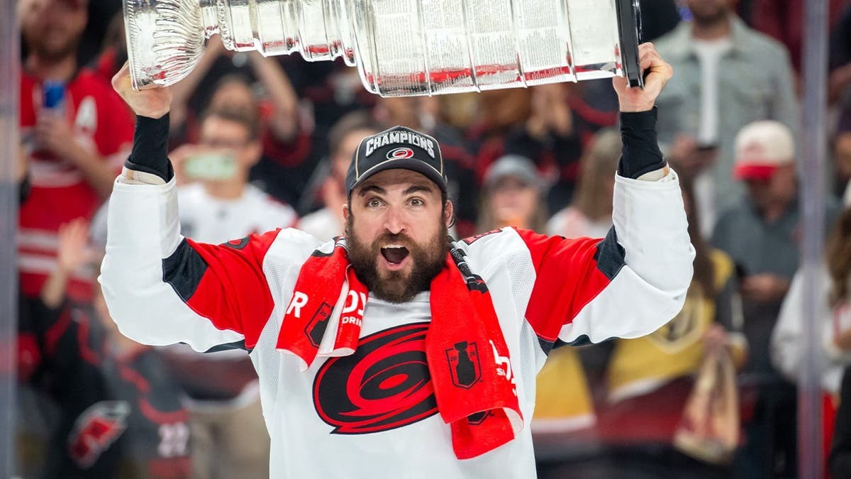 Hurricanes player William Carrier fills the Stanley Cup full of a Quebecois delicacy at george magazine