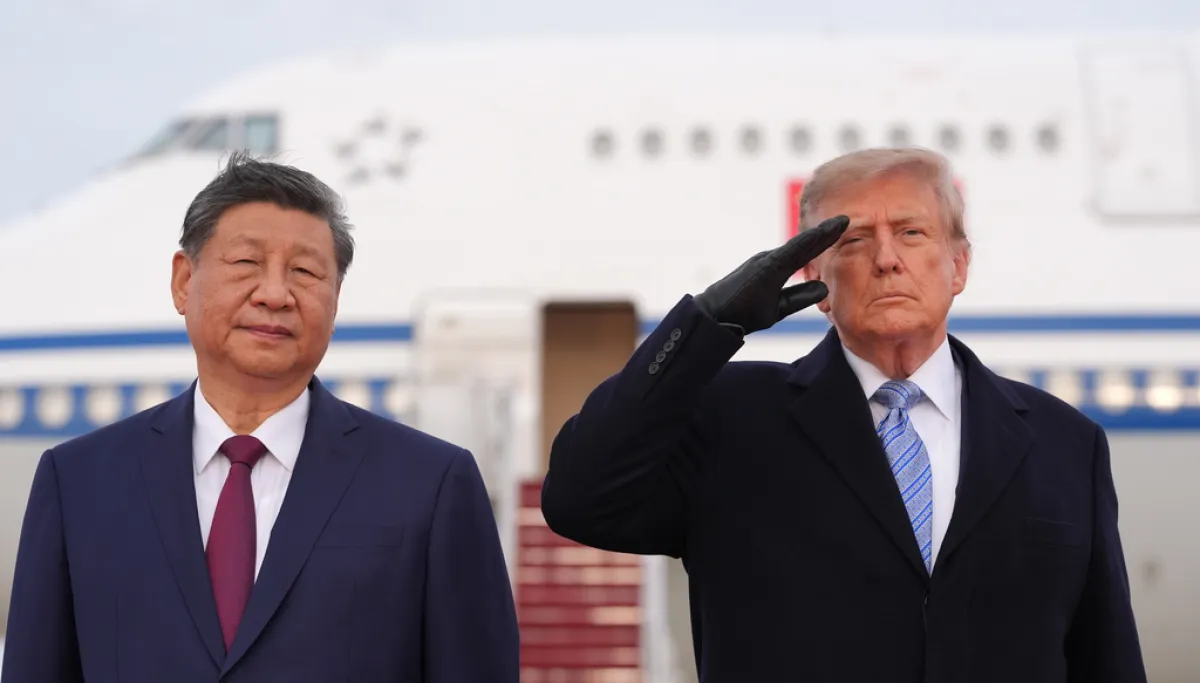 Trump winces during military flyover at Xi arrival ceremony  at george magazine