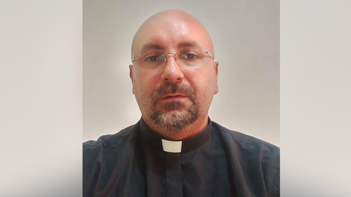 Priest killed by falling crucifix during livestreamed Mass as worshippers rush to help  at george magazine