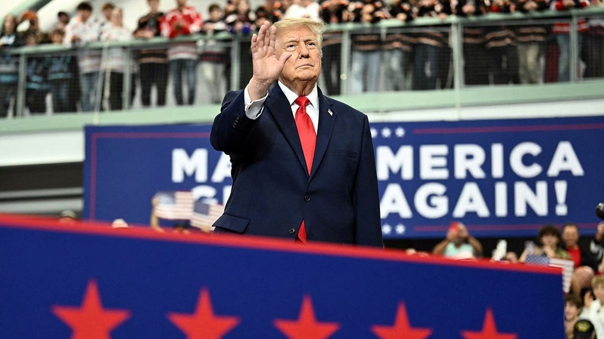 Trump signs pardons for Alaska diesel mechanics onstage during rally touting major energy deals  at george magazine